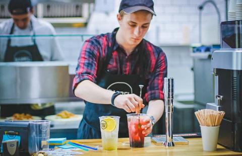 stock image of a barrista mixing a drink