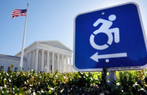 A wheelchair sign in front of the United States Supreme Court Building