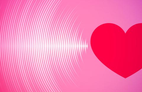 A pink box with a red heart. Sound or light waves are coming from the heart.