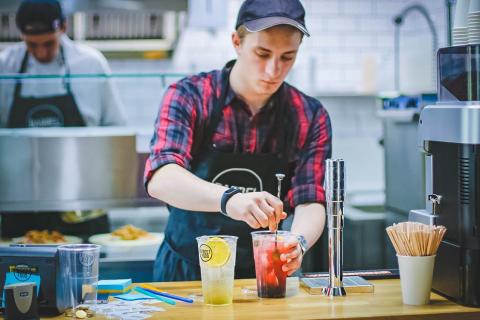 stock image of a barrista mixing a drink