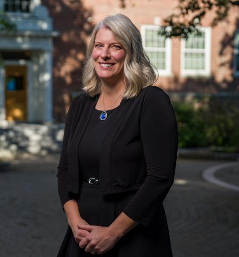 Sarah Smith standing in front of a brick building