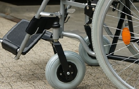 picture of the bottom half of a wheelchair