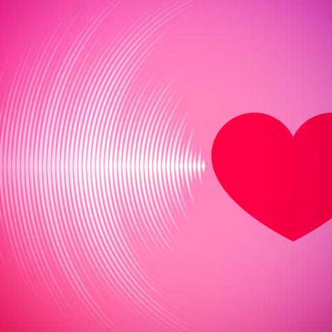 A pink box with a red heart. Sound or light waves are coming from the heart.
