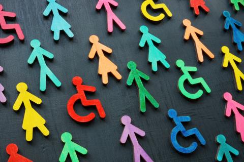 Image showing paper doll figures in varying colors, some in wheelchairs
