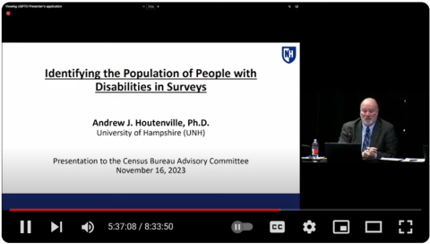 A screen shot of the YouTube video showing the title slide from the presentation, "Identifying the Population of People with Disabilities in Surveys" by Andrew J. Houtenville, Ph.D University of New Hampshire (UNH), Presentation to the Census Bureau Advisory Committee November 16, 2023 -- to the right of the title slide is a still frame showing Andrew Houtenville seated as part of a panel.