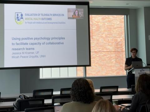 A person giving a presentation in a meeting room 