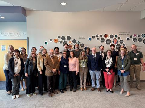 Several people standing for a group photo