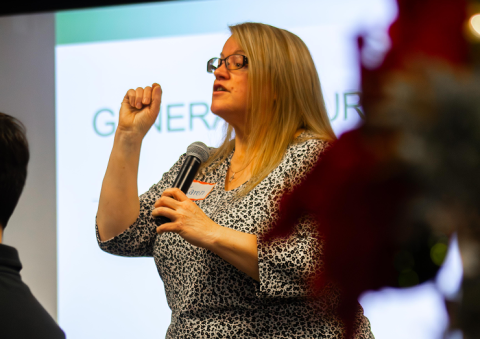 A women speaks or lectures to a class.