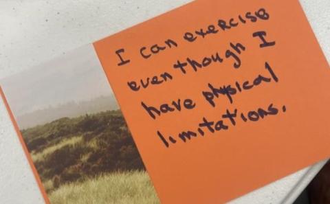 Orange card with a handwritten note that says, “I can exercise even though I have physical limitations.”