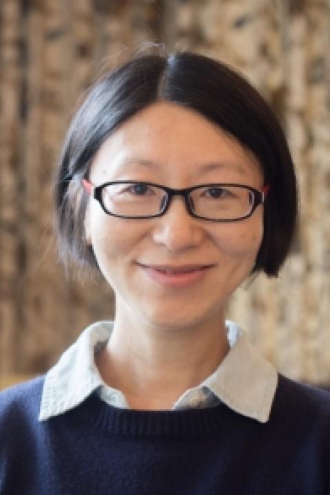 Liu Yang is a woman with short black hair and glasses